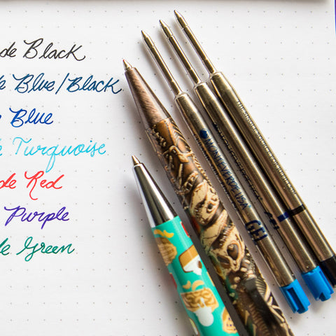 Close-up of Monteverde gel rollerball pens with colorful ink swatches on a dotted page
