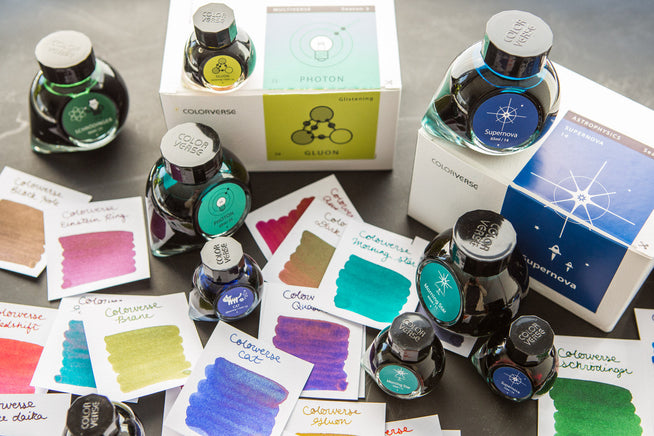 Colorverse Ink bottle and swabs spread out artfully around a desk