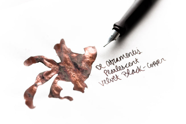 De Atramentis Velvet Black Copper fountain pen ink splatter with fountain pen