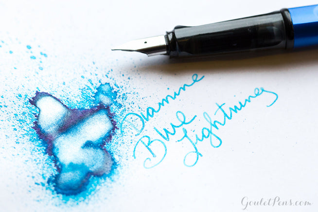 Diamine Blue Lightning ink splatter with LAMY safari fountain pen uncapped