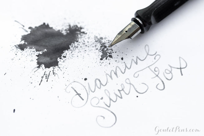 Diamine Silver Fox fountain pen ink splatter and LAMY AL-star