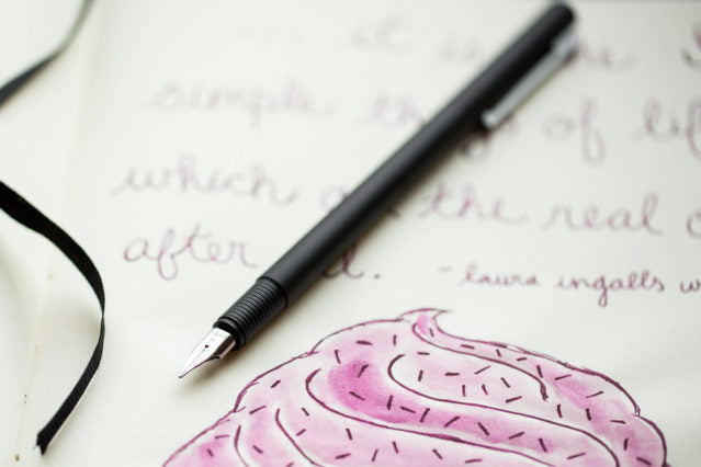 Lamy CP1 fountain pen on drawing of a cupcake
