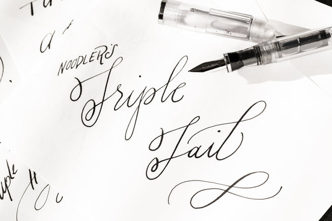 Handwriting with variation in line widths, text says Triple Tail