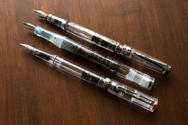 TWSBI ECO, Go and 580 uncapped on a desk. 