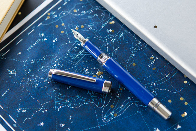 TWSBI Classic Fountain Pen on blue background