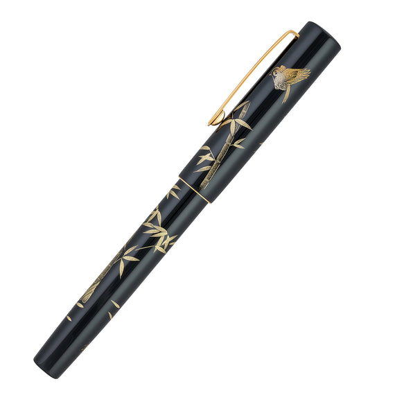 Black pen with gold accents on a white background